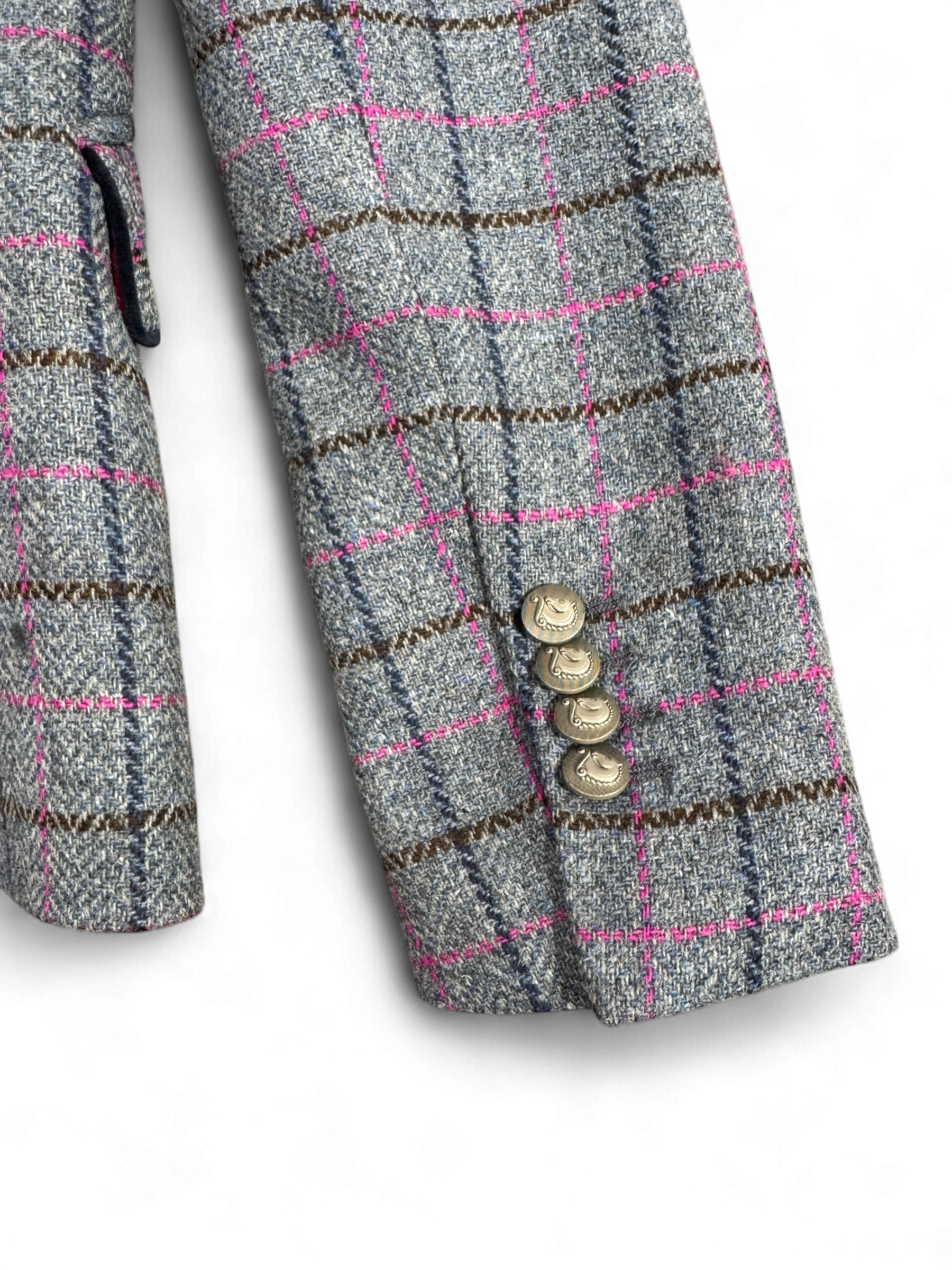 Cuff view of Bariloche Caparra blazer with gold button detail and pink overcheck