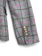 Cuff view of Bariloche Caparra blazer with gold button detail and pink overcheck
