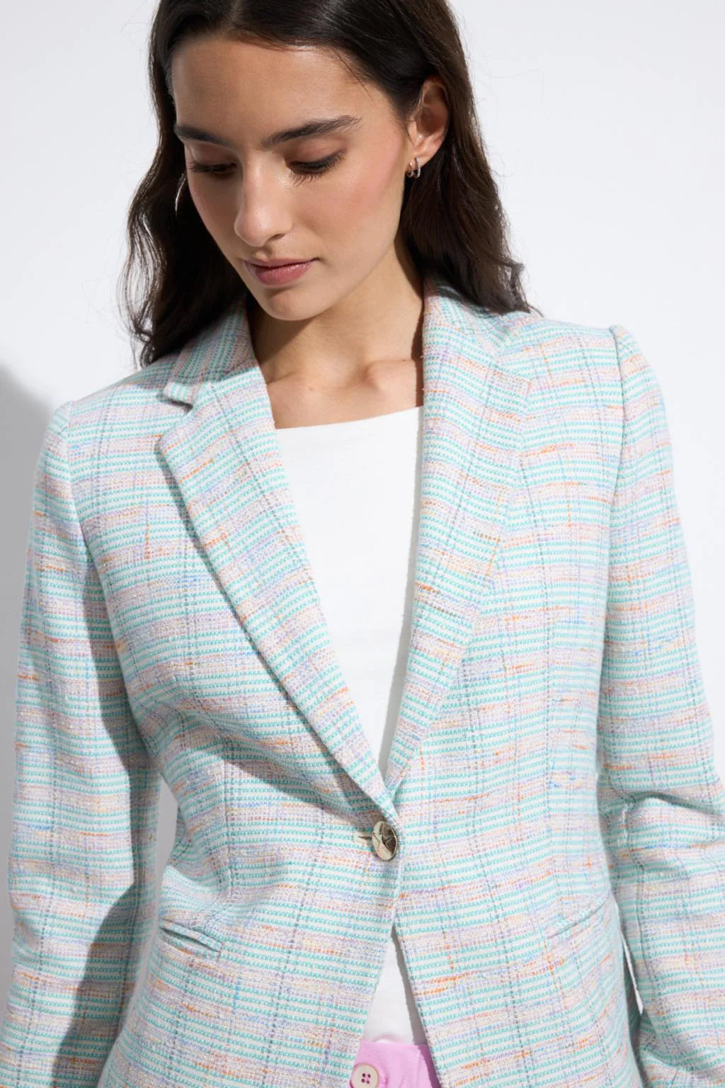 Bariloche Caracola aqua and pink check blazer close-up of lapel and button detail