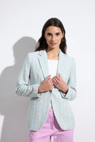 Bariloche Caracola fitted aqua tweed jacket styled with pink trousers