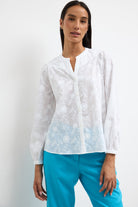 Bariloche Clavel white embroidered flower blouse front view relaxed fit