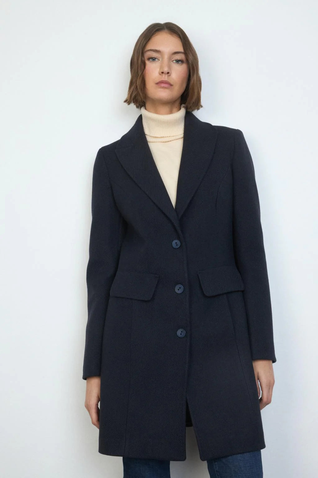 Full-length shot of Bariloche Cobijo long coat in navy wool
