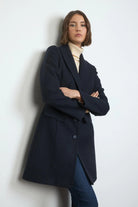 Close-up of navy Bariloche Cobijo women’s coat button details and lapel