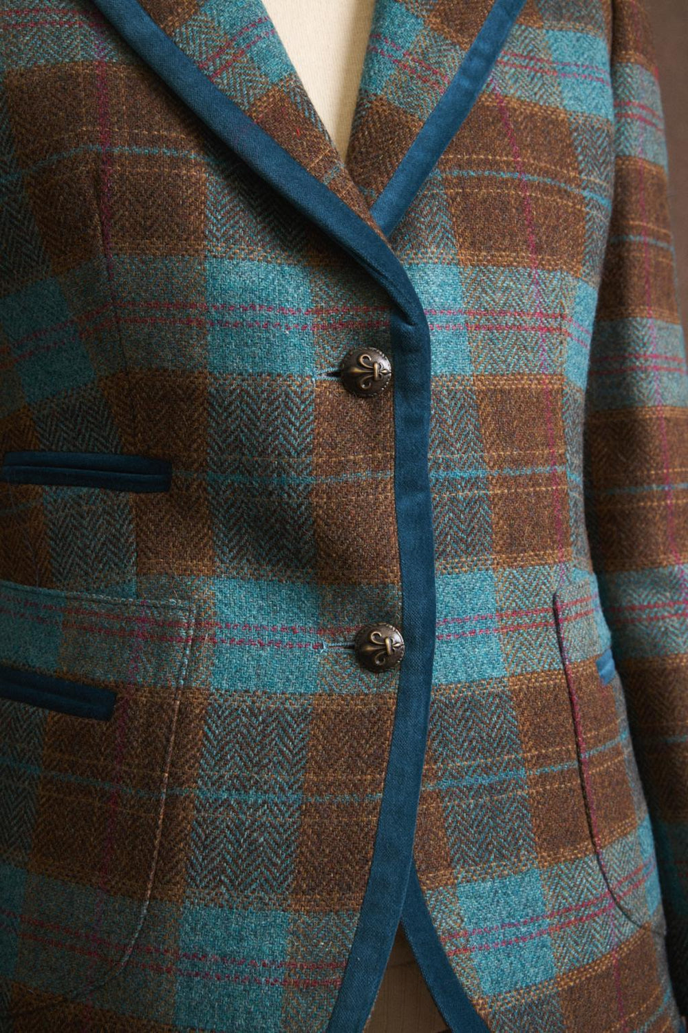 Bariloche Etrusca Blazer Detail shot showing velvet-trimmed pockets and metal buttons