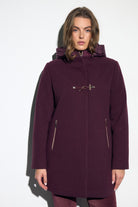 Bariloche Gata burgundy hooded duffle-style coat with quilted inner hood, decorative toggle and zipped pockets – front model view.