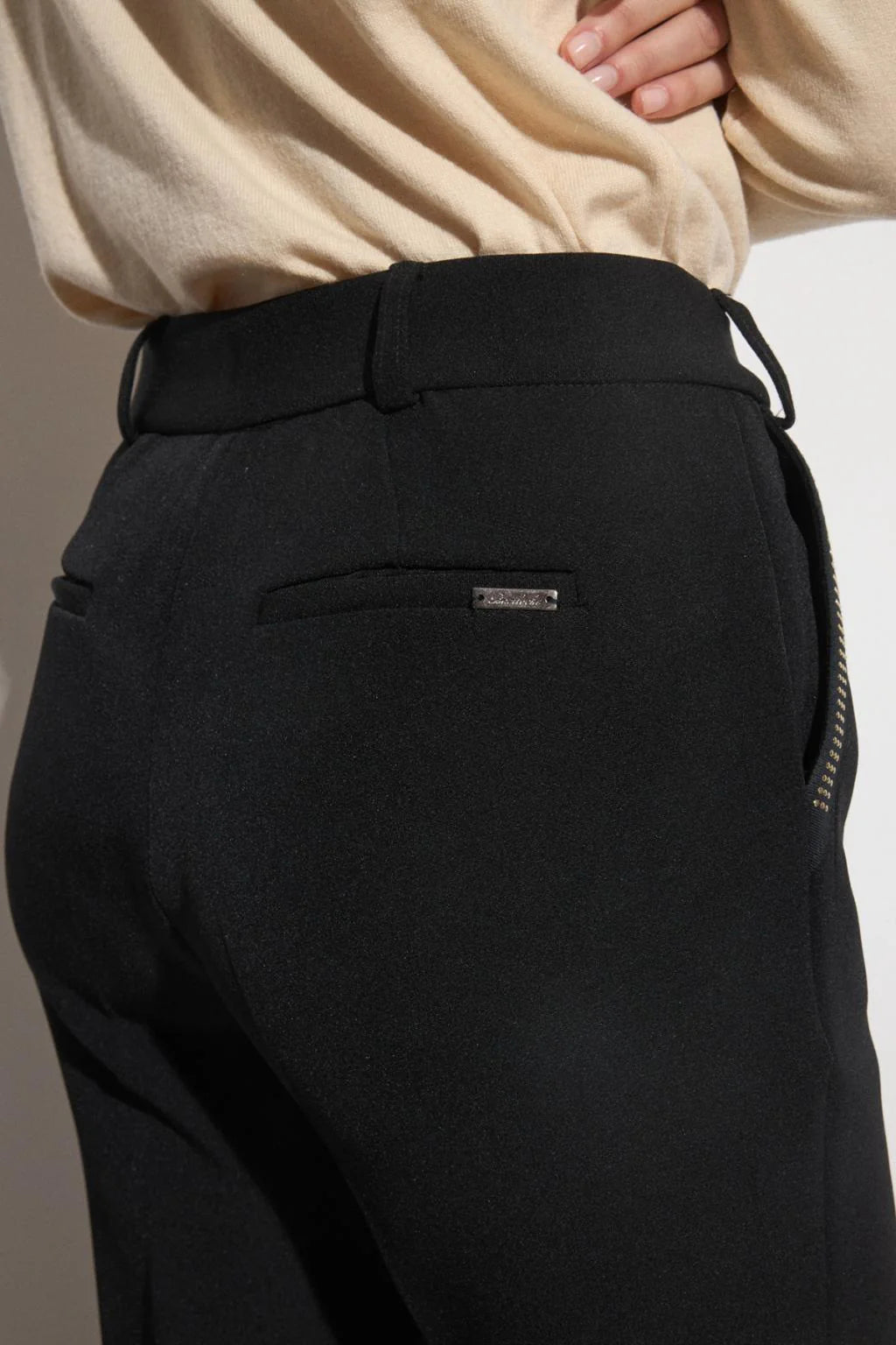 Back view of Bariloche Luncaria black straight-leg suit trousers with smart pocket detail.