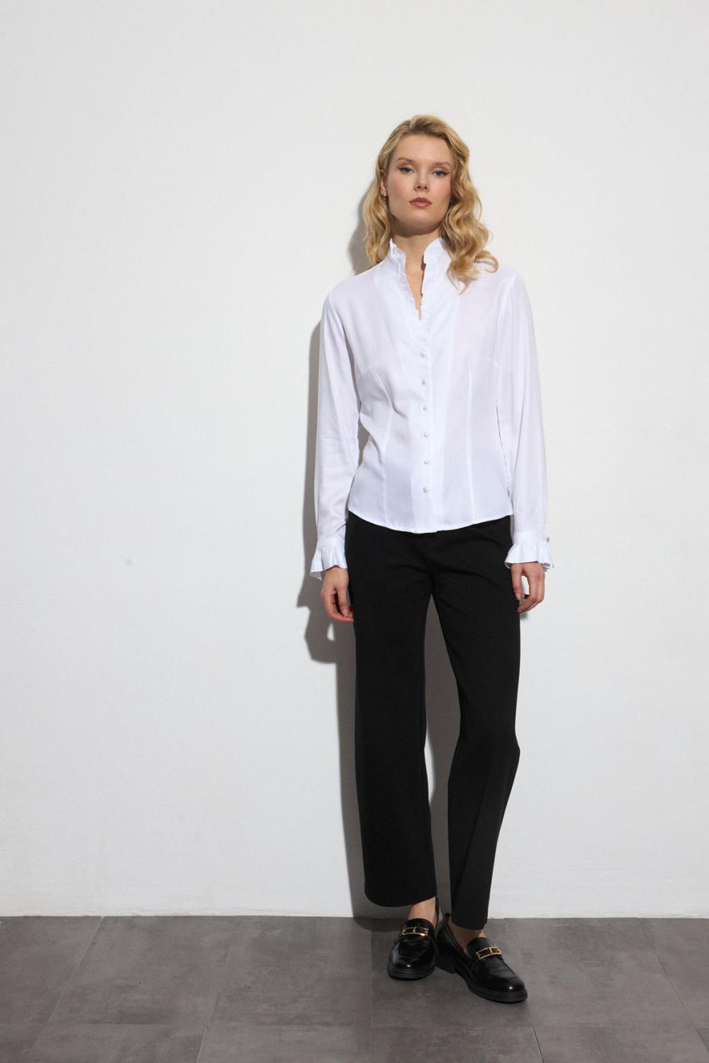 Bariloche white organic cotton shirt styled with black trousers