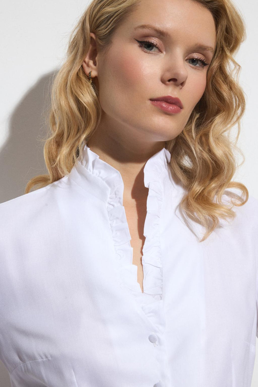 Bariloche Navona shirt with soft ruffle trim and slim silhouette