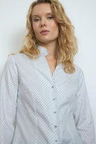 Close-up of navy dash print and buttons on Bariloche Onuba shirt