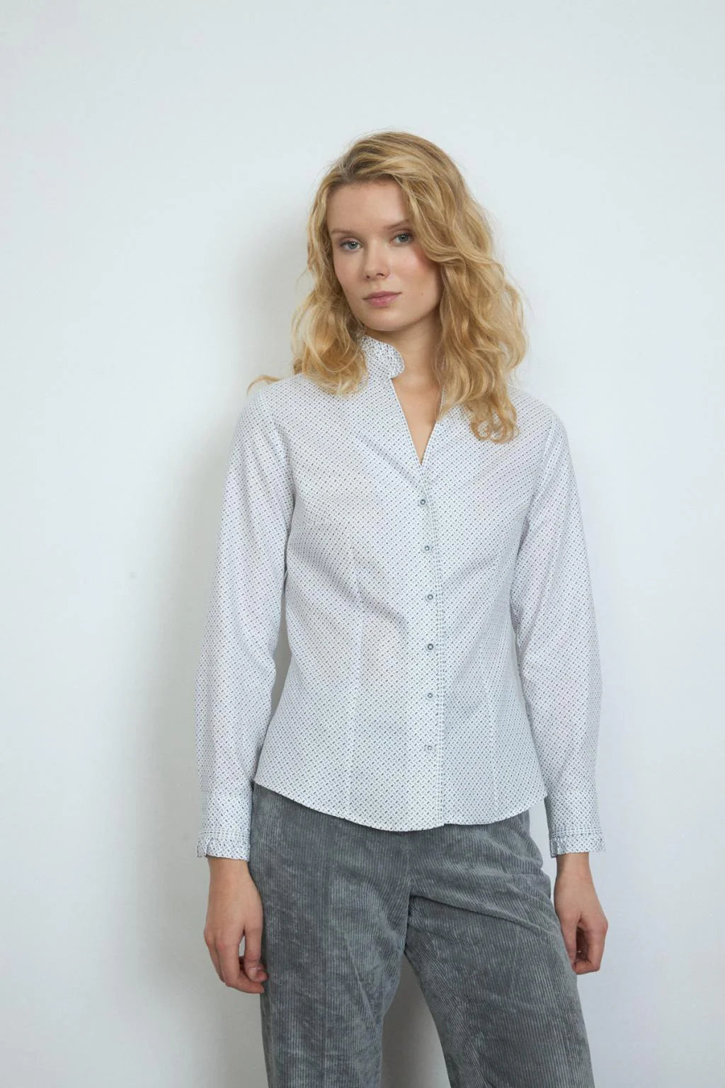 Bariloche white and navy dash print shirt with ruffle collar and long sleeves