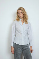 Bariloche white and navy dash print shirt with ruffle collar and long sleeves