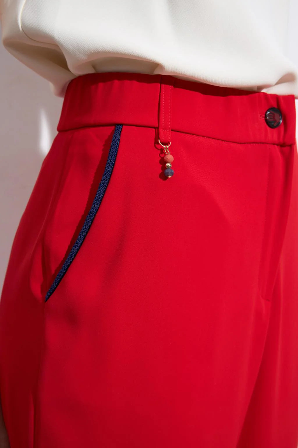 Bariloche Renacer red trousers pocket detail
