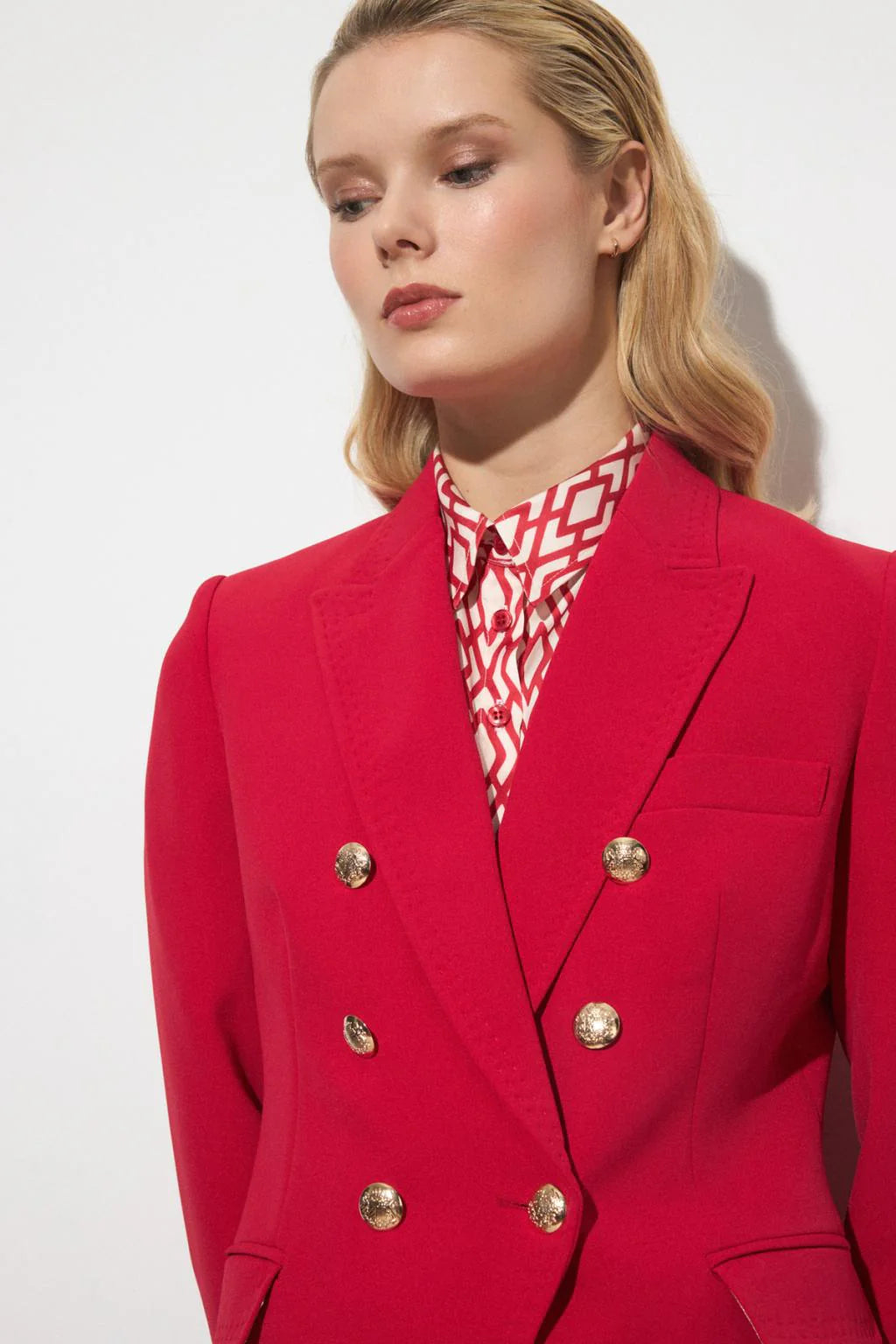 Women’s red double-breasted blazer with notched lapels and gold buttons