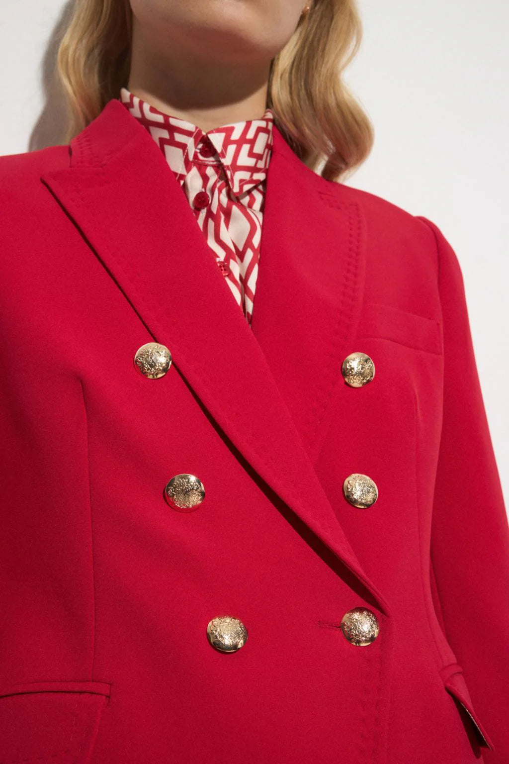 Close-up of gold buttons and lapel on Bariloche Sonseca blazer