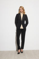 Model wearing Bariloche Tivoli black blazer with rhinestone lapels