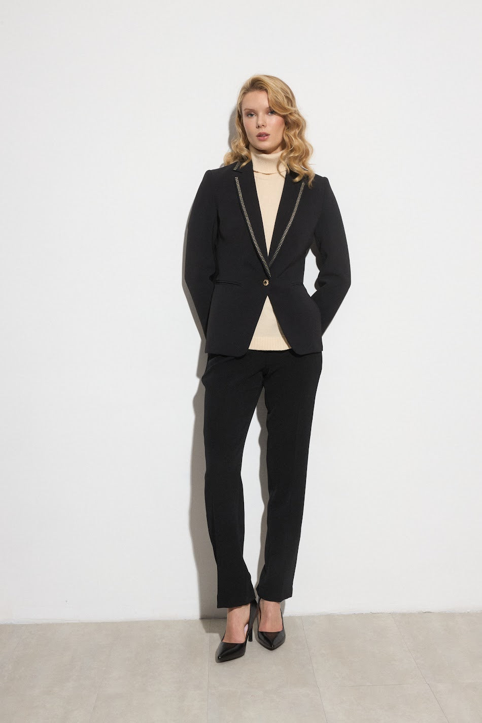 Model wearing Bariloche Tivoli black blazer with rhinestone lapels