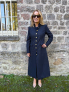 LBariloche Valent navy long herringbone coat with fitted waist and gold buttons – front lifestyle view