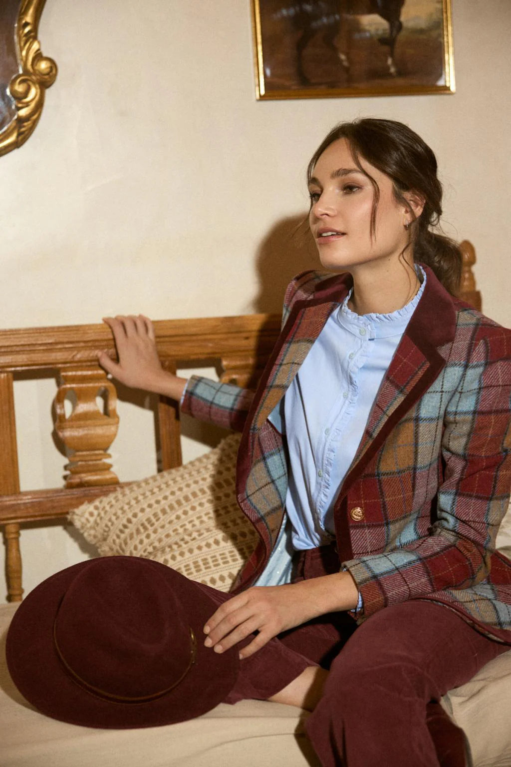 Bariloche blue ruffle shirt worn under check blazer