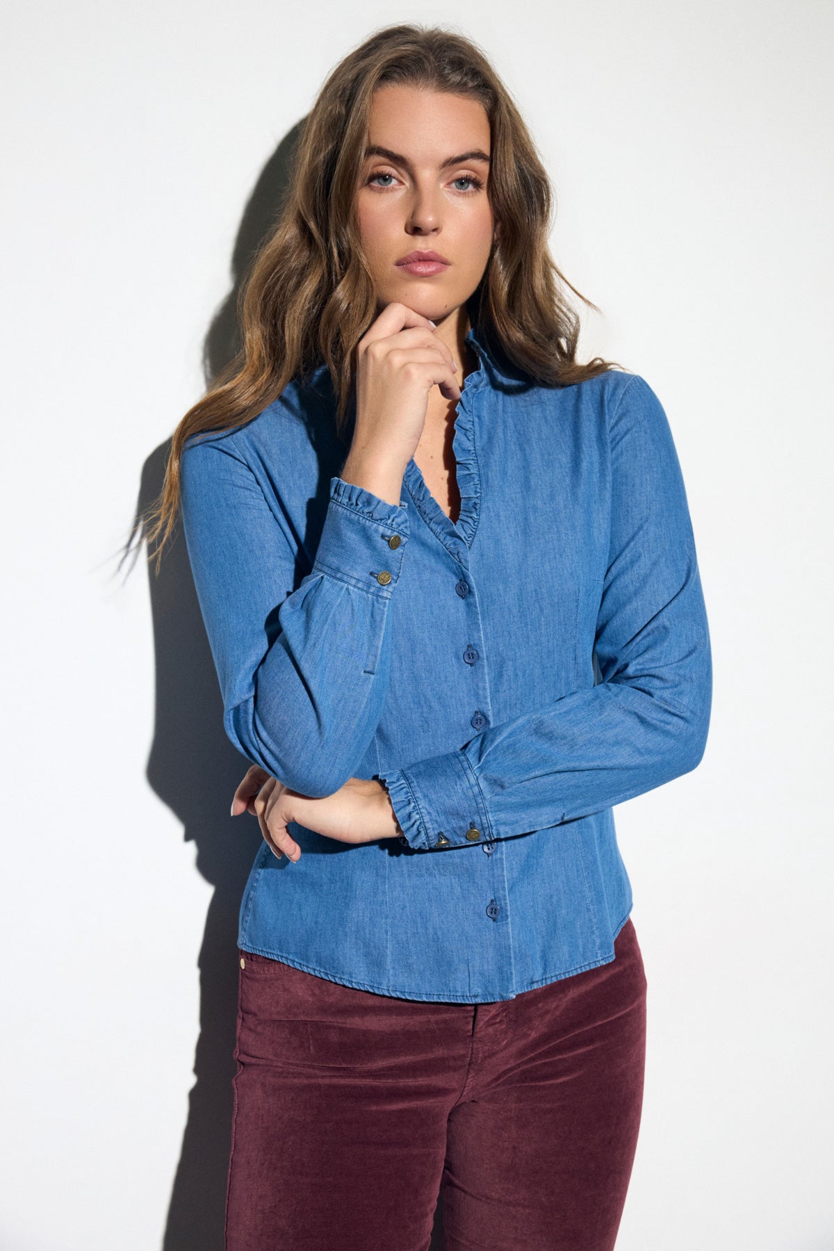     Bariloche Vica blue denim frill V-neck button blouse front view on woman