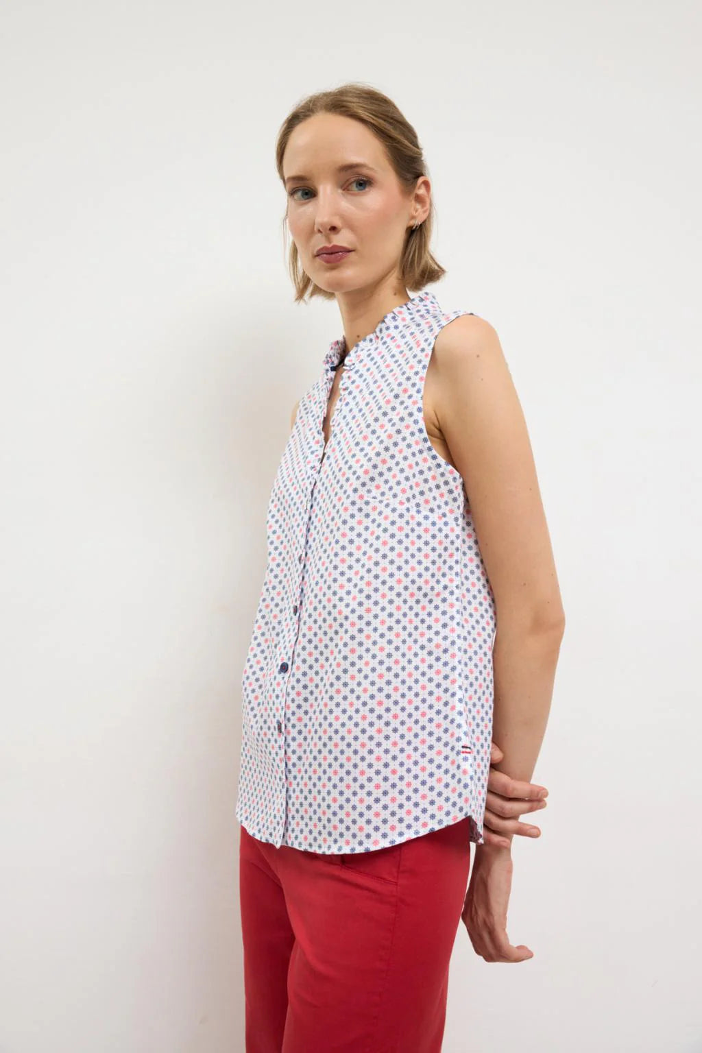 Bariloche printed blouse styled with red trousers
