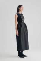 Black embellished midi dress with structured tulip skirt