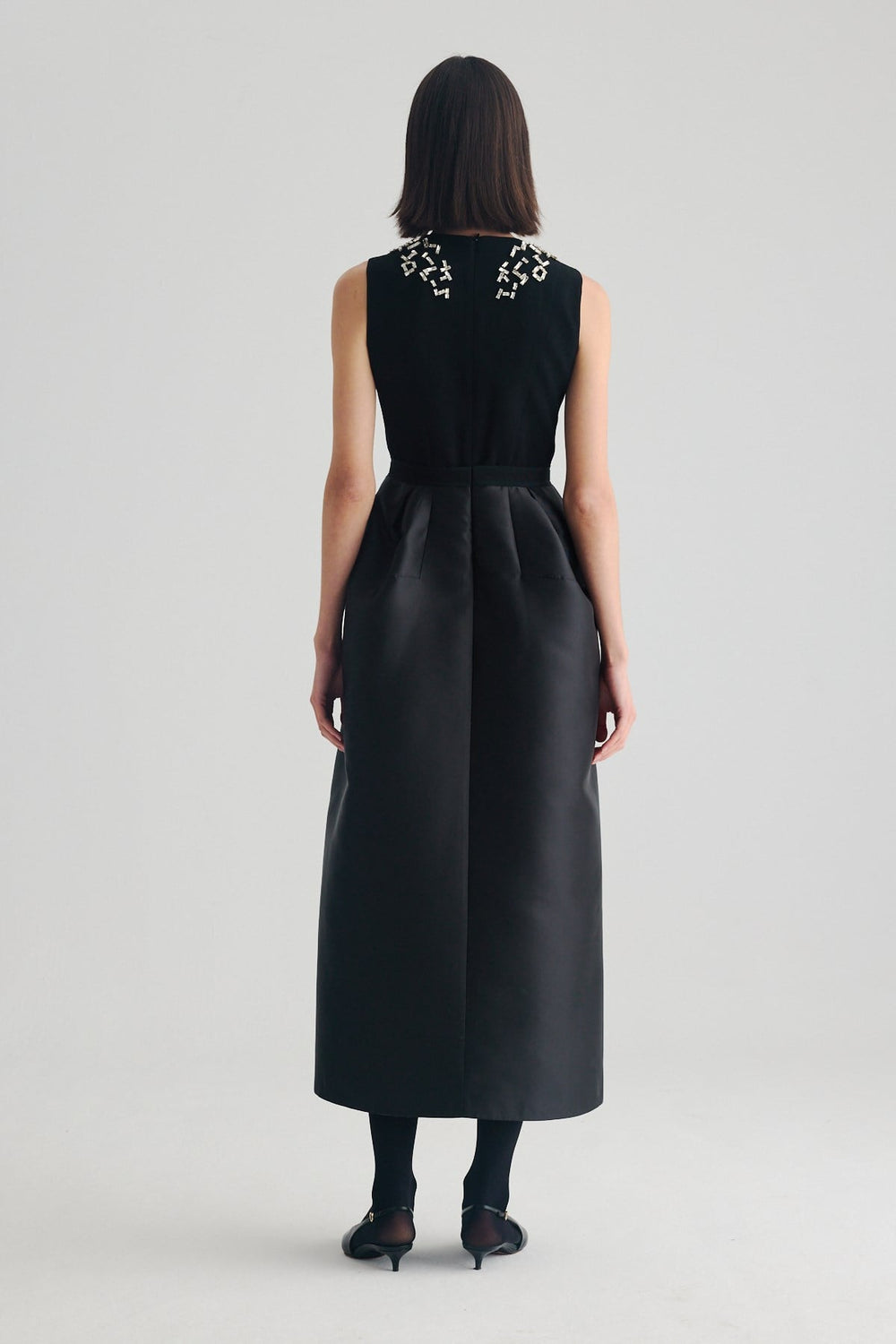 Back view of Birelin Couture black sleeveless formal occasion dress