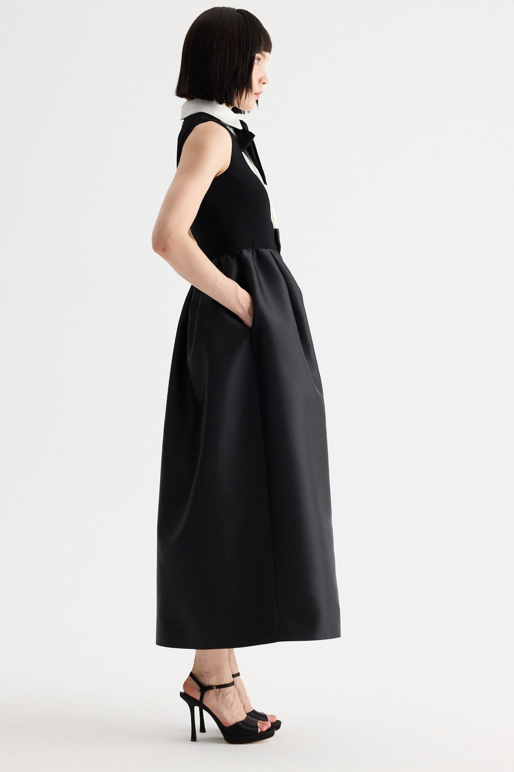 Birelin Couture black and white sleeveless occasion dress with full tulipskirt