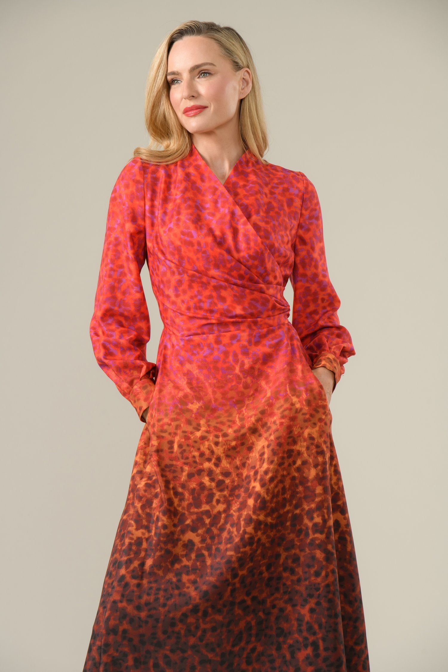 Close-up of wrap neckline and long sleeves of Agnes occasion dress by Caroline Kilkenny