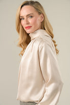 Side view of Caroline Kilkenny Gwyneth cream blouse with gathered shoulders