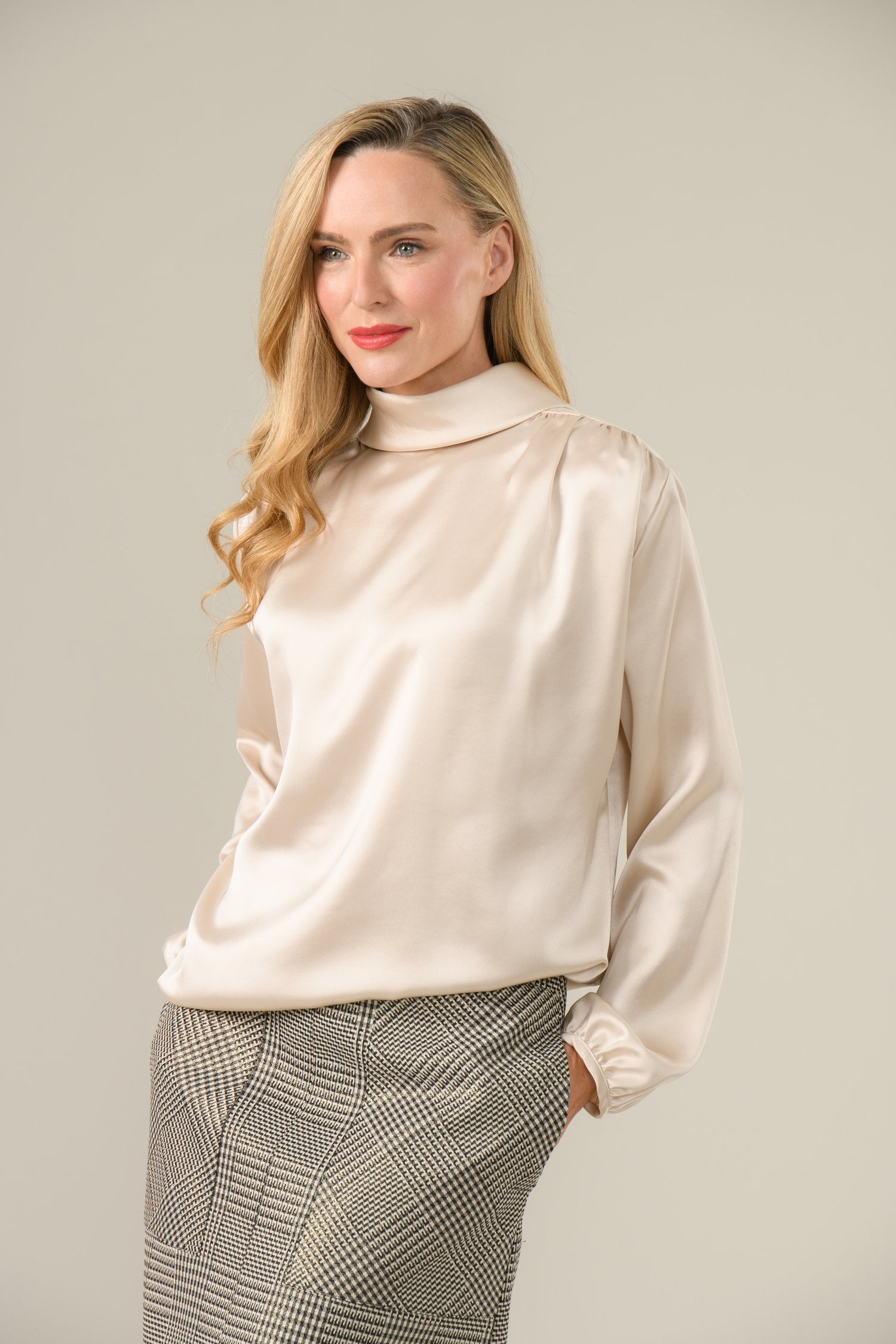 Model wearing Caroline Kilkenny Gwyneth silky cream golden shimmer blouse front view