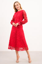 Caroline Kilkenny Iris red lace occasion dress shown at an angle