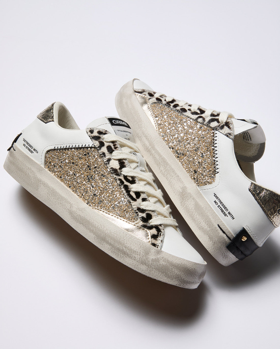 Crime London glitter animal print trainers angled pair view