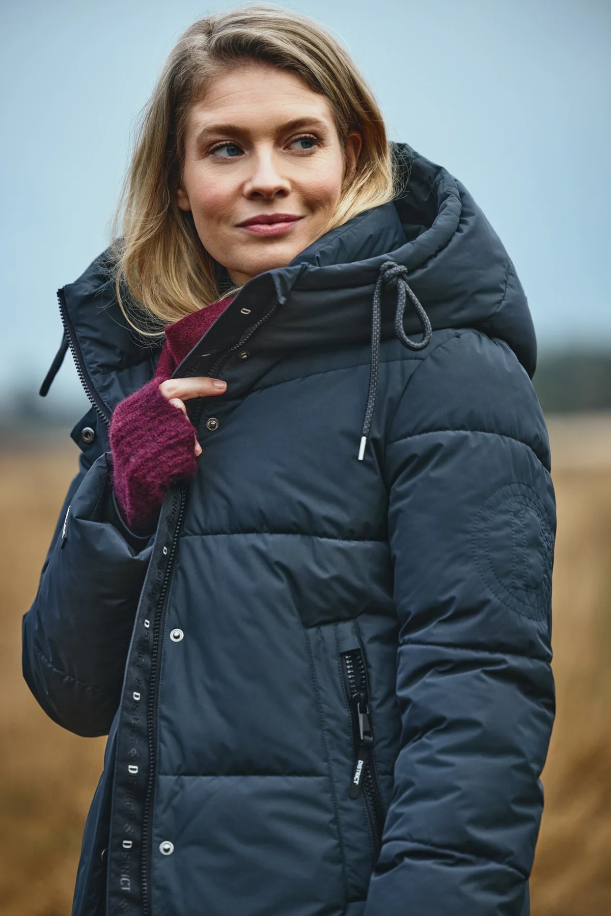 District Lungo long hooded padded coat back view showing quilted silhouette