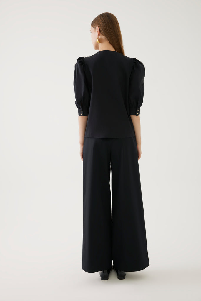 Exquise Black Puff Shoulder Top With U neckline From The Back