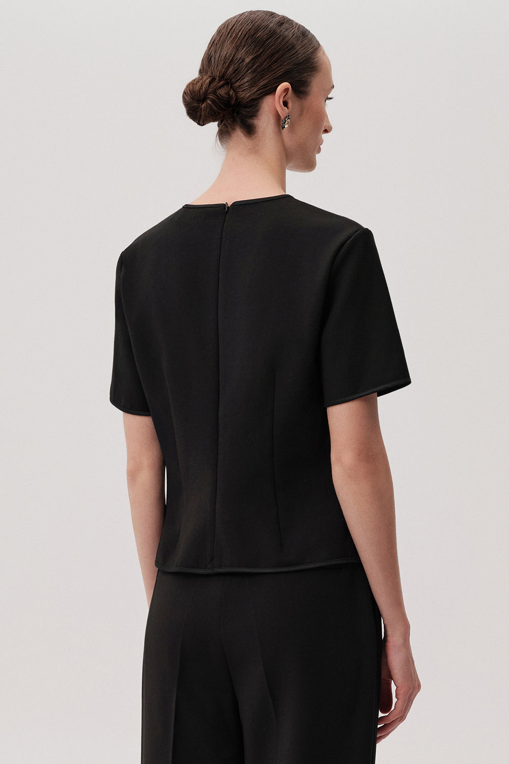 Exquise Black Dove Top – back view with short sleeves and structured shape