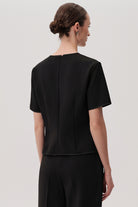 Exquise Black Dove Top – back view with short sleeves and structured shape