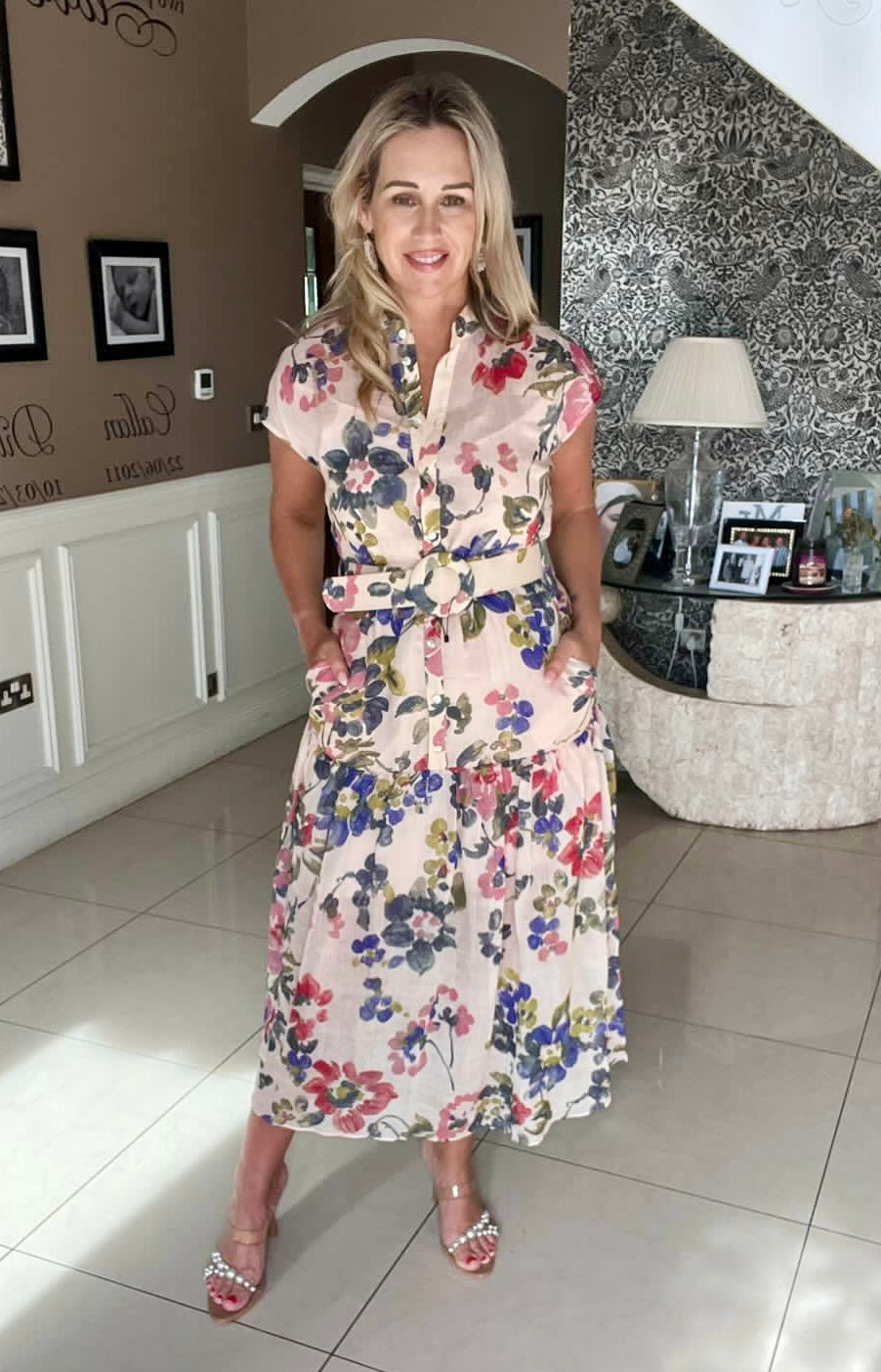 Exquise Evelyn floral dress with cap sleeves, tiered skirt, and belted waist in lightweight summer fabric worn by Lisa Modernirishmom