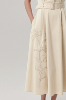     Exquise cream embroidered shirt dress with pleated skirt
