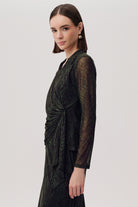 Side angle of Exquise Kinslee K wrap blouse in green snake print