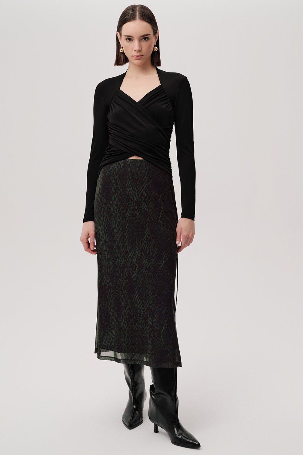 Exquise Linda K animal print skirt – side view showing sheer hem and boots