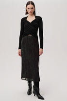 Exquise Linda K animal print skirt – side view showing sheer hem and boots