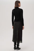 Exquise Linda K skirt – full outfit from back with matching top and boots