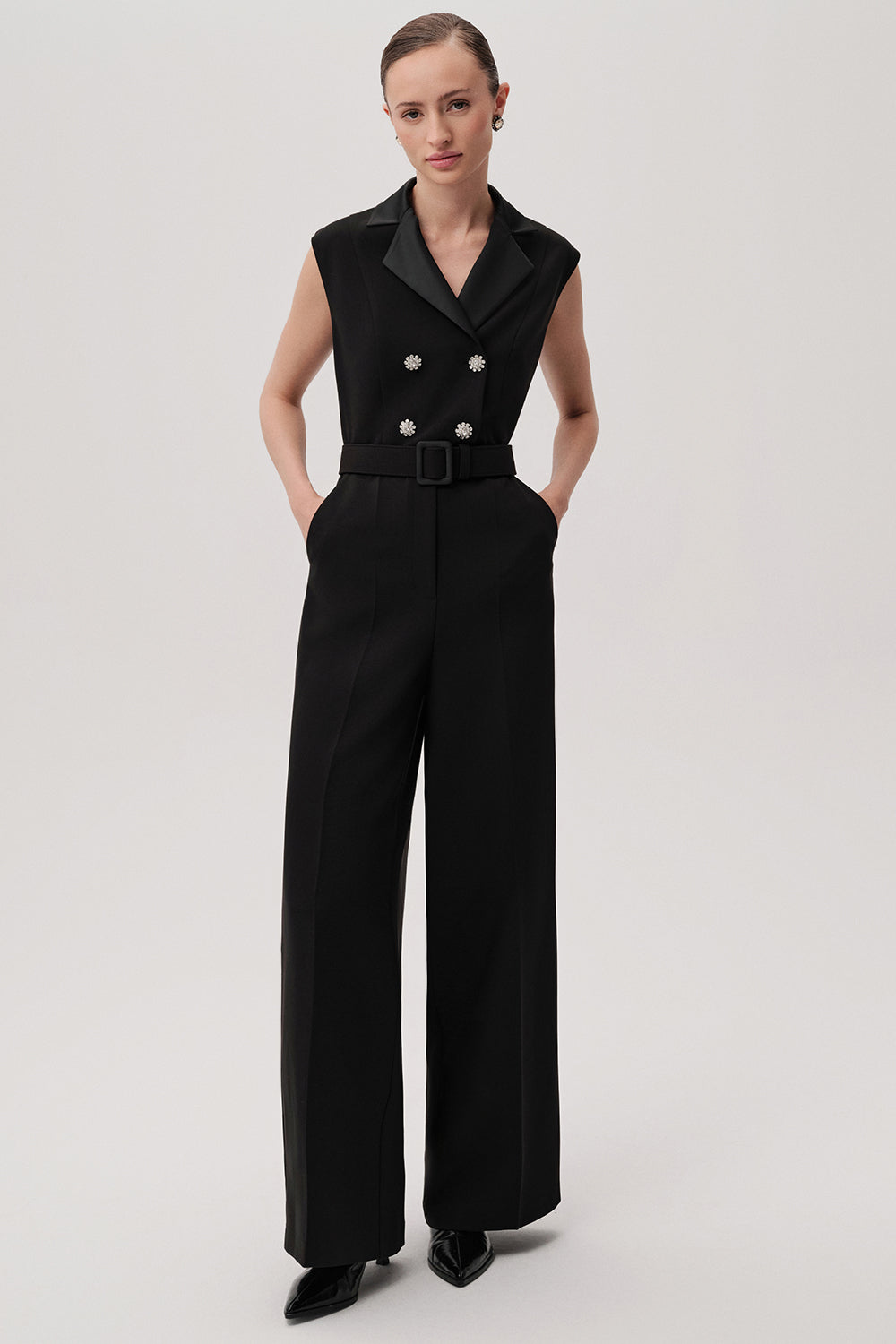 Full-length view of sleeveless black onyx jumpsuit by Exquise styled with formal shoes