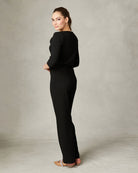Elegant draped black top by Fee G with asymmetric neckline