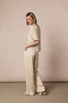     Fee G champagne tailored satin trousers side view with matching top