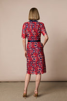 Back view of Fee G Stella red navy floral lace dress