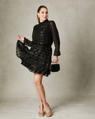 Fee G black jacquard lurex dress with sheer sleeves and fluid skirt