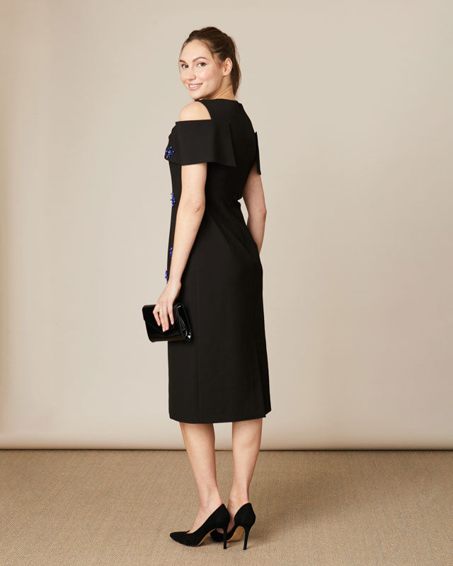 Back view of Fee G Phoebe black bow off-shoulder embellished midi dress shower cut out shoulder details.