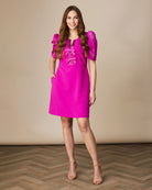 Fee G Isabelle bow front mini dress in vibrant fuchsia pink with puff sleeves