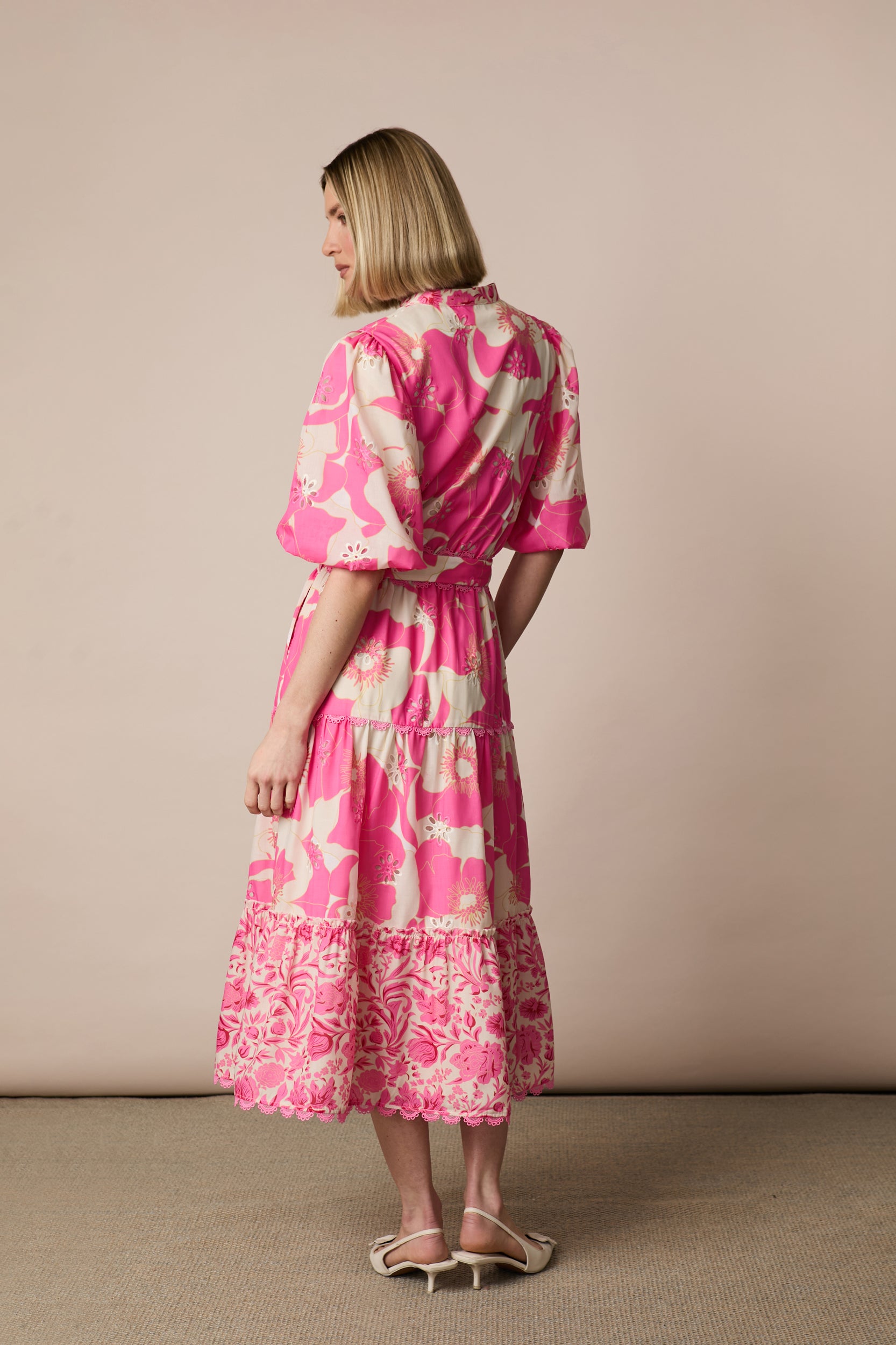 Back view of Fee G Eve pink floral tiered midi dress